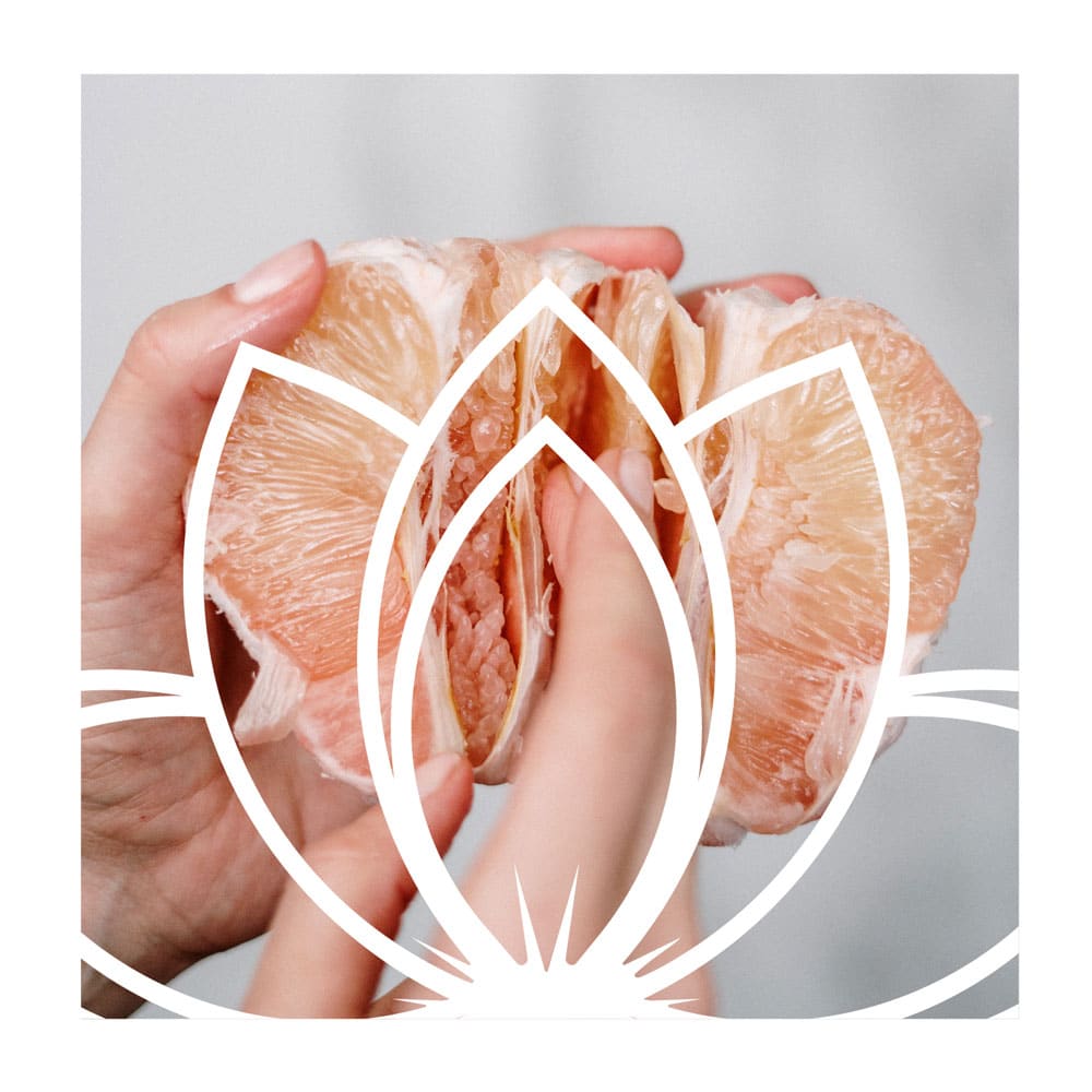 AVIVA Woman brandmark overlaid on image of torn open clementine, health and wellness branding