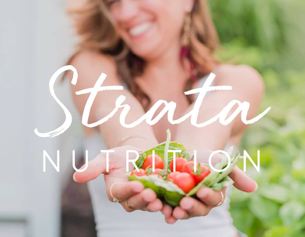 Strata Nutrition logotype overlaid on a photo of Kylie holding out fresh garden tomatoes in her hands