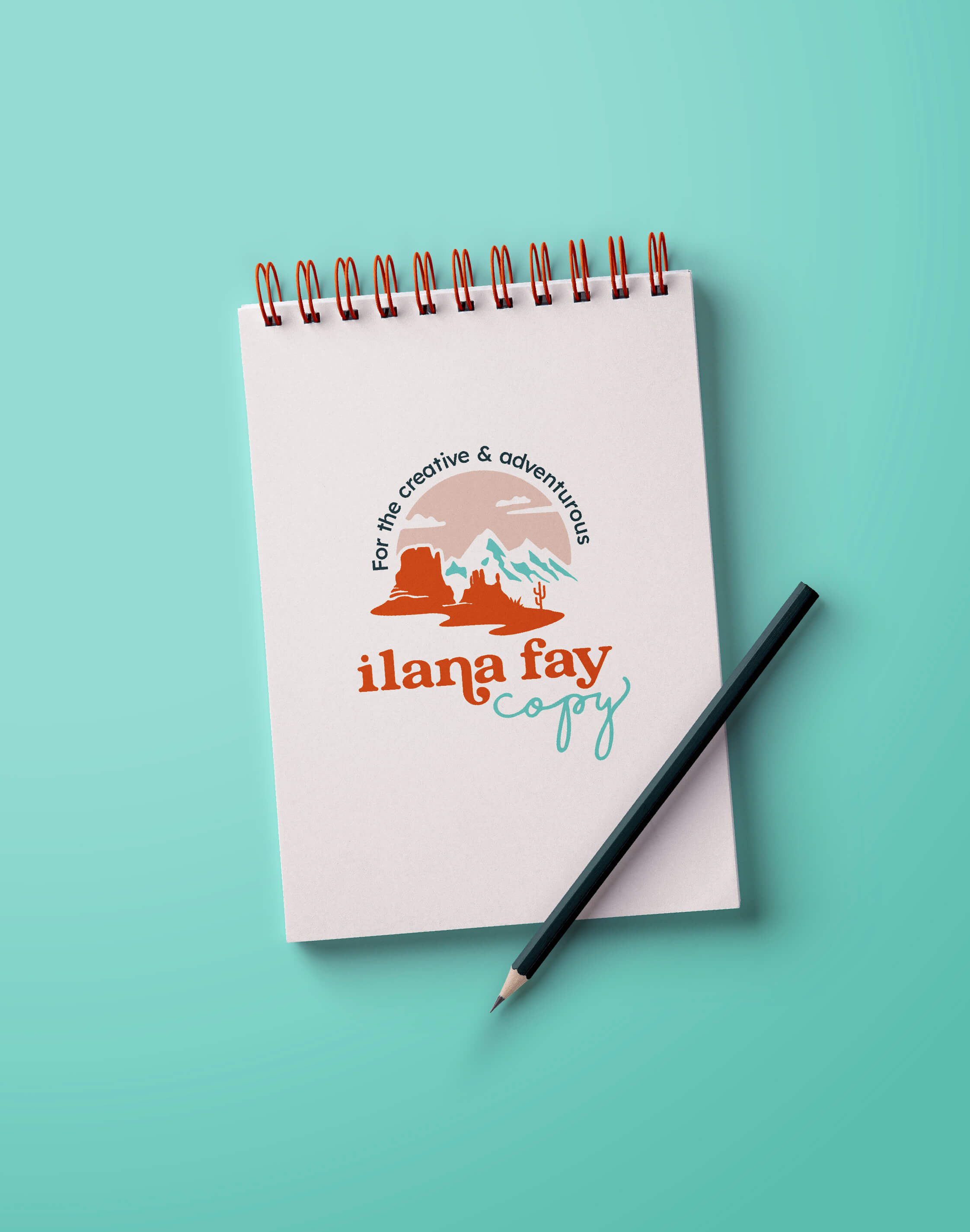 Ilana Fay Copy, copywriter for outdoors brand, graphic logo design for th creative and adventurous shown on a notepad with a pencil